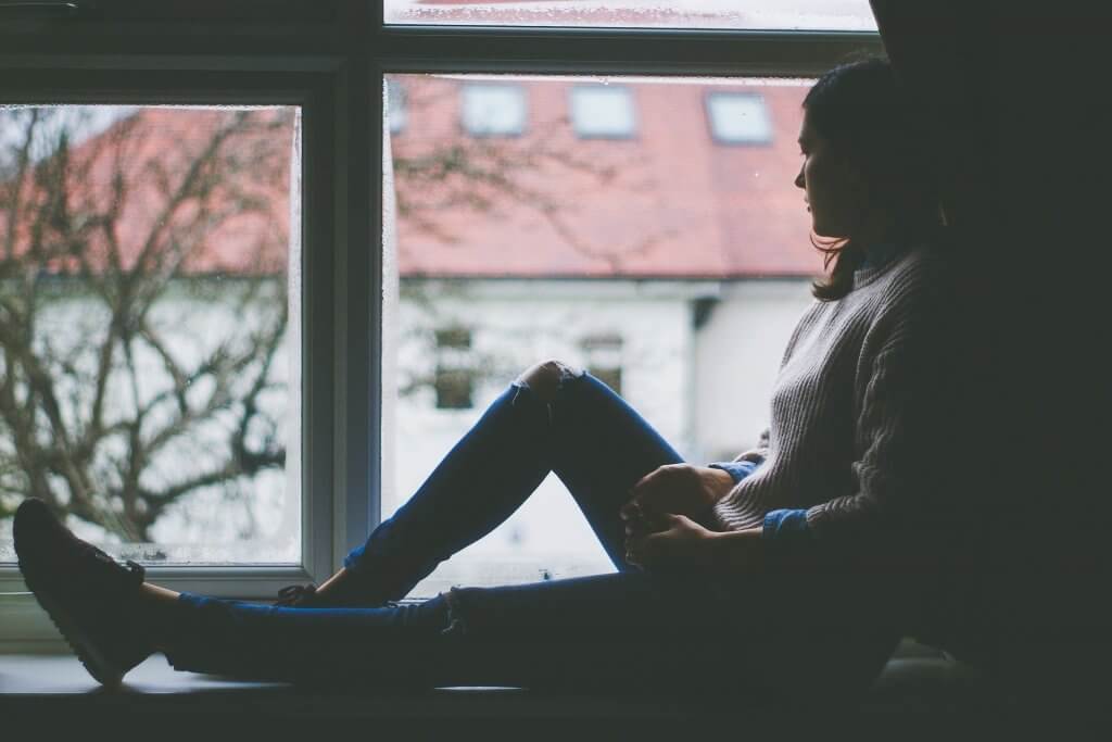 Lady feeling lonely due to Covid 19